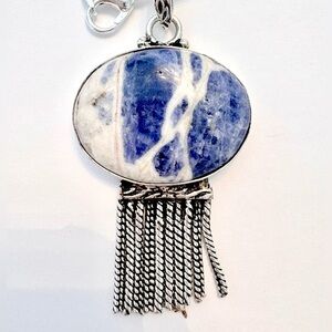 Beautiful, 2 inch, Sodalite stone with 10 
 silver chains on the bottom.